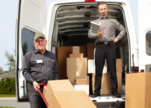 Professional movers handling a compact flat move in Westnorwood