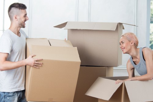 Professional movers loading furniture during house removals in Westnorwood