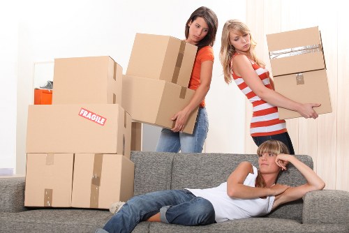 Moving furniture from a local flat into storage near a busy West Norwood street